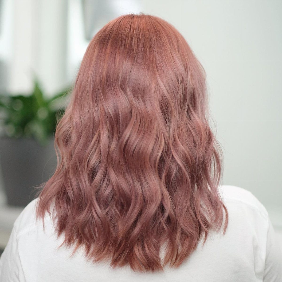 3 Color Hair Ideas: 15 Looks from Burnt Orange to Emerald 8 Wavy shoulder-length hair dyed in a shimmering rose gold pinkish tone.