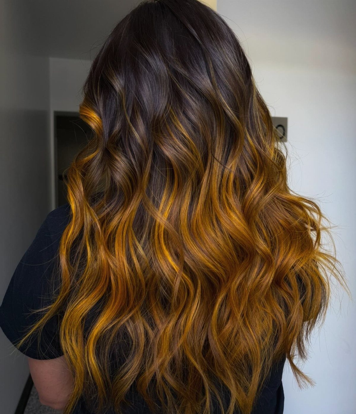 3 Color Hair Ideas: 15 Looks from Burnt Orange to Emerald 15 Long wavy hair with dark brown roots transitioning to golden yellow ombré ends