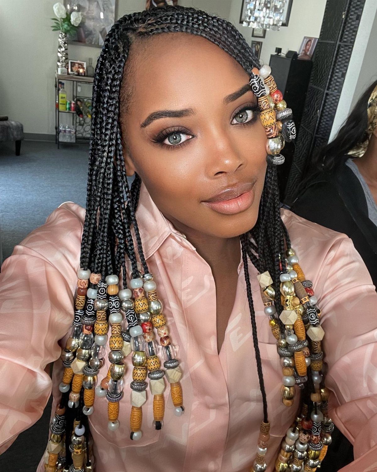 20 African Hair Styles Braids 17 Woman with black tribal braids decorated with colorful wooden and decorative beads.