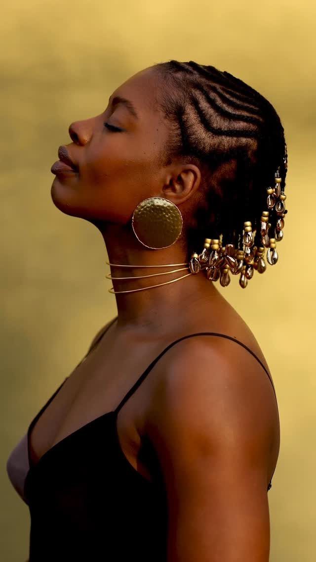 Afro Hair 4c Style Ideas: 19 Looks From Cornrows to Locs 1 Woman with intricate cornrows, gold disc earrings, and a gold neck collar.