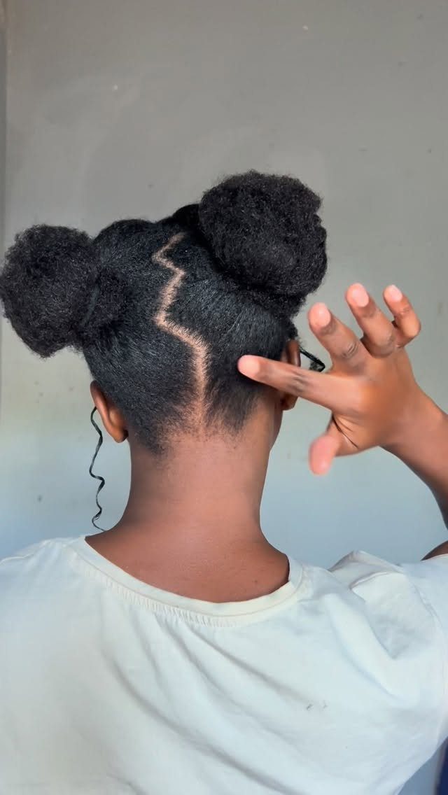 Afro Hair 4c Style Ideas: 19 Looks From Cornrows to Locs 14 Two high buns with a zigzag part on dark natural 4C hair.