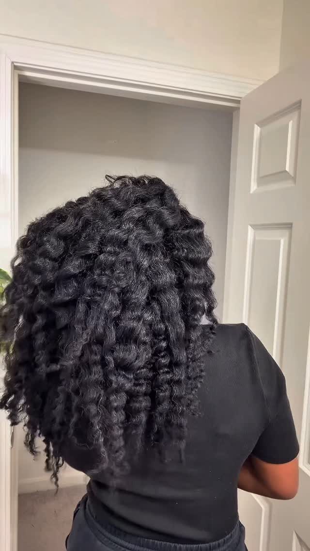 Afro Hair 4c Style Ideas: 19 Looks From Cornrows to Locs 6 Long black hair styled in defined, coiled twists seen from the back.