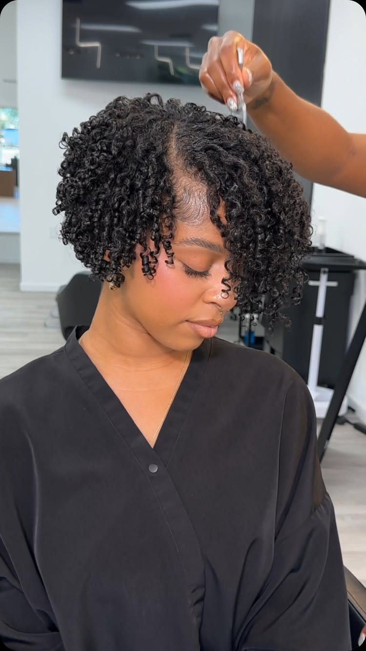 Afro Hair 4c Style Ideas: 19 Looks From Cornrows to Locs 5 Woman with short, defined curly 4C hair being styled in a salon.