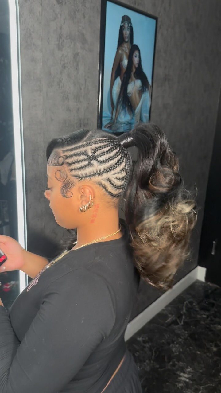 Woman with cornrow braids styled into a high curly ponytail with blonde highlights.