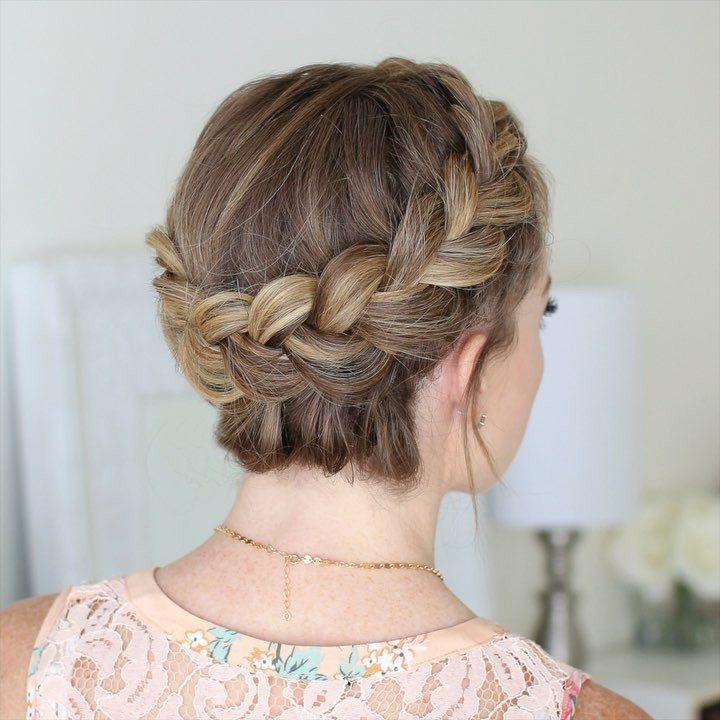 Blonde hair styled in a thick crown braid wrapped around the head.