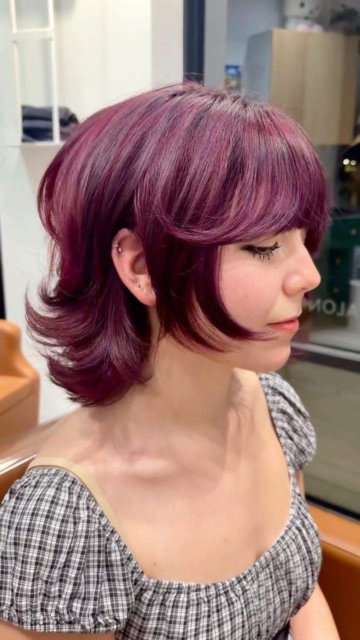 6 Dark Velvet Red Hair Ideas for Bobs, Bangs and Ombre 3 Woman with deep burgundy red hair styled in a layered bob cut.