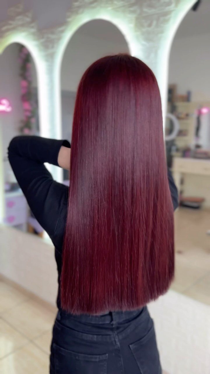 6 Dark Velvet Red Hair Ideas for Bobs, Bangs and Ombre 4 Long straight dark velvet red hair seen from behind on a person.