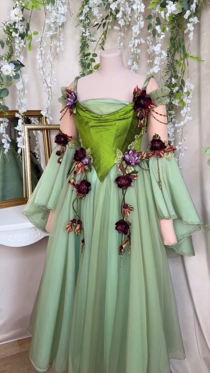 Green fantasy gown with a structured corset bodice and purple floral appliqués
