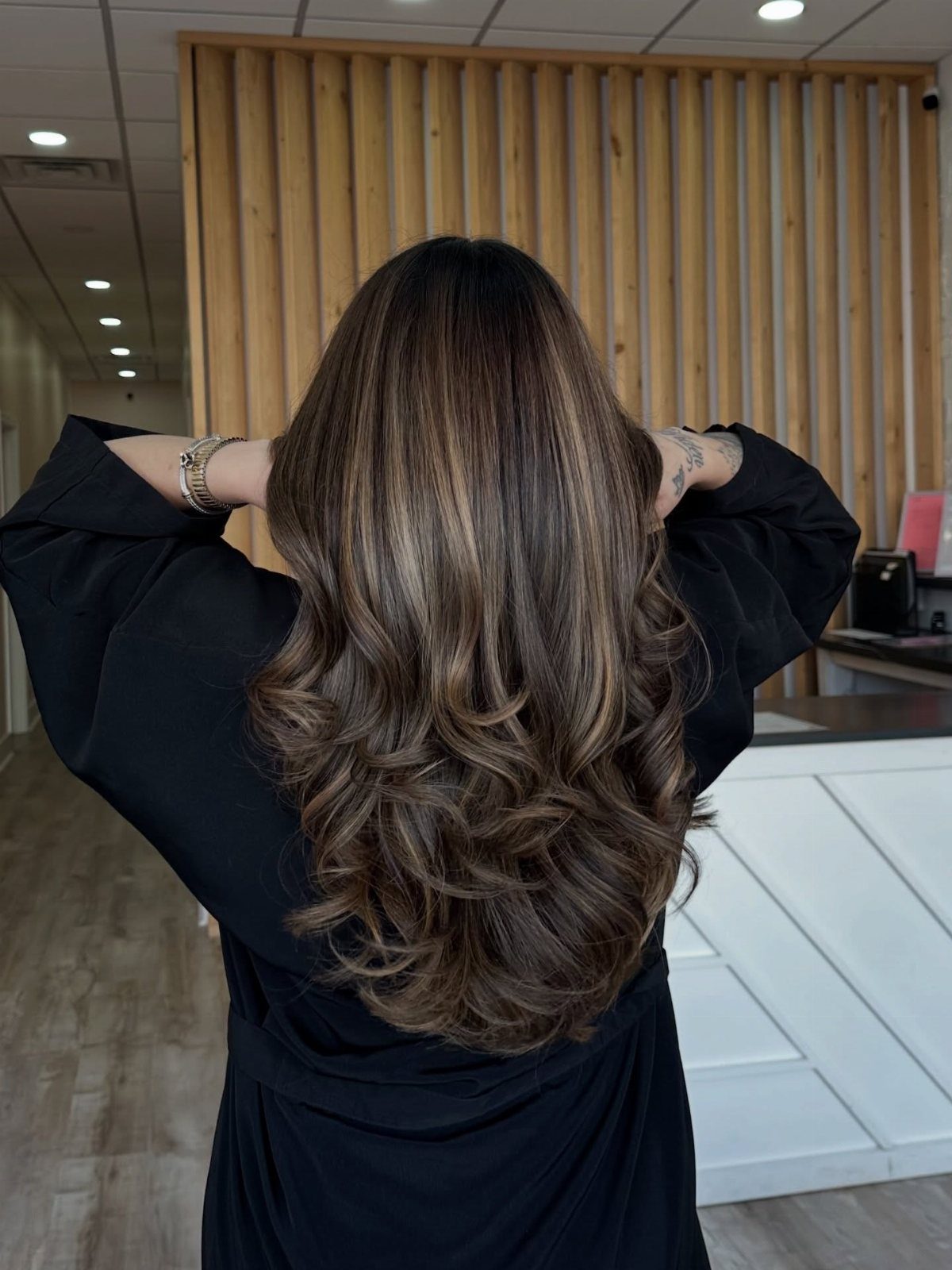12 Long Brown Hair Ideas with Highlights, Curls and Layers 10 Long wavy brown hair with caramel highlights and layered curls from behind