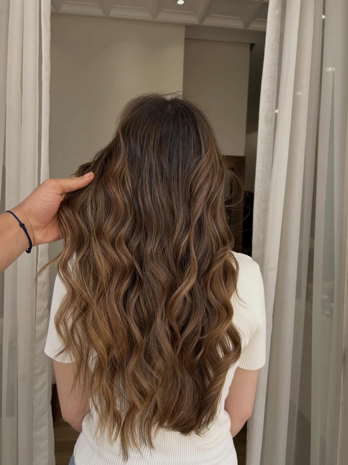 10 Natural Curls Hairstyles for Every Length and Style 8 Long brown hair styled in loose relaxed waves seen from the back