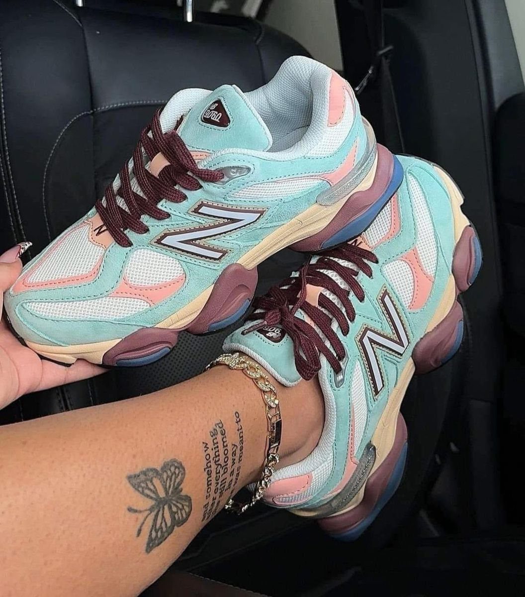 New Balance 9060 Pink and Blue Sneakers: 6 Ideas 3 Light blue and pink New Balance 9060 sneakers worn by a person in a car.