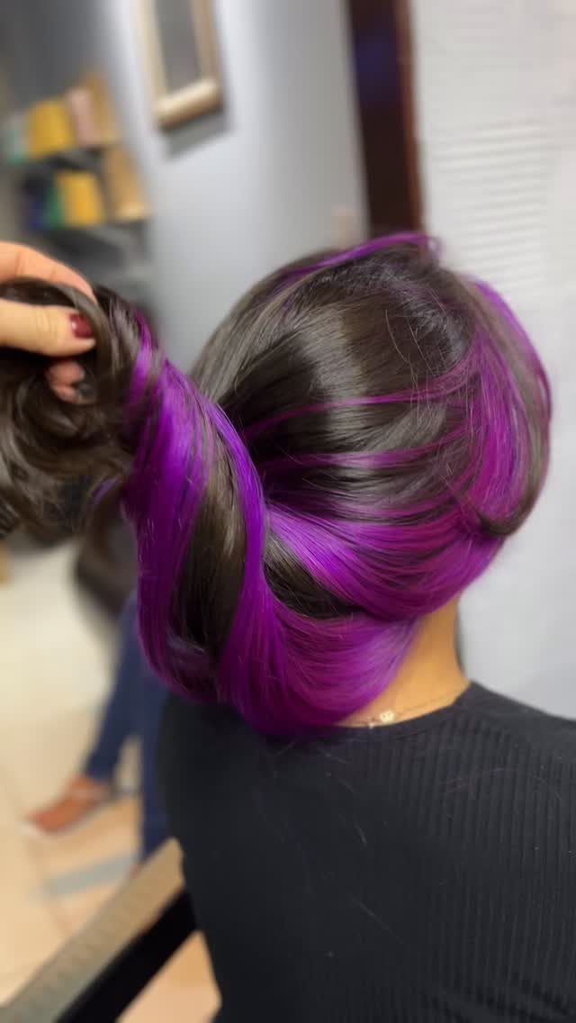 5 No Bleach London Vivid Berry Hair Color Ideas 3 Dark brown hair with vivid purple and berry highlights being held up.