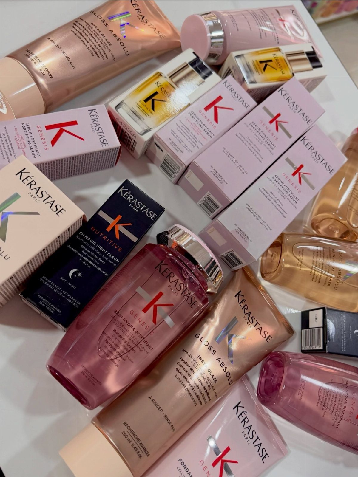 7 Products for Healthy Hair: Scalp Care to Deep Conditioners 2 Kérastase hair care bottles and boxes in pink and gold on white background