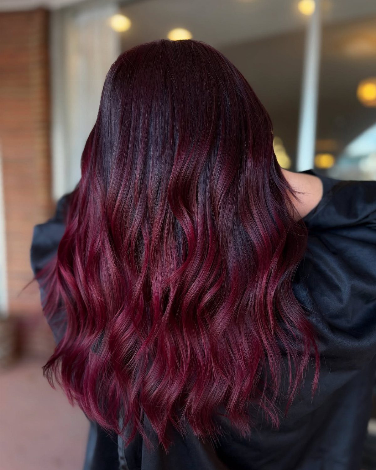 13 Red Undertones Hair Ideas, From Copper to Burgundy 10 Long wavy hair with a dark burgundy to violet-red ombre color transition.