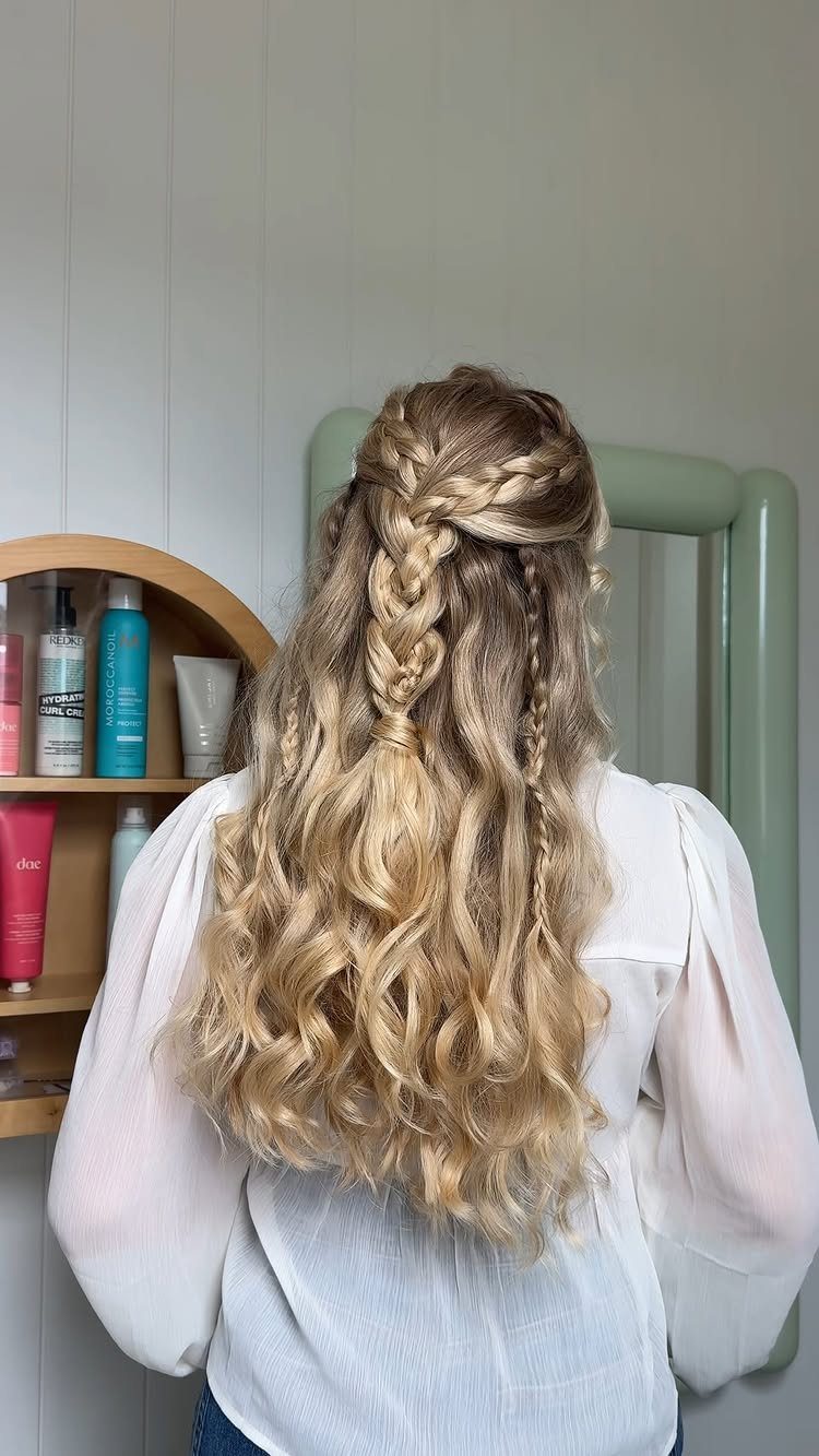 8 Simple Half Up Hairstyles for Every Occasion 2 Blonde curly hair styled in a braided half-updo from a back view.