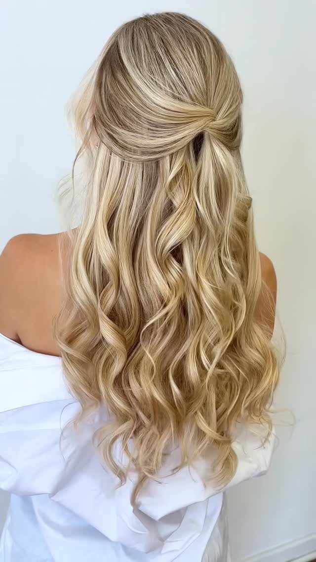 8 Simple Half Up Hairstyles for Every Occasion 4 Long wavy blonde hair styled in a twisted half-updo from the back