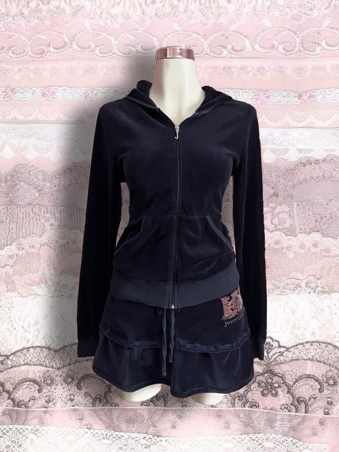 Navy blue velour tracksuit set with zip-up hoodie and mini skirt on mannequin.