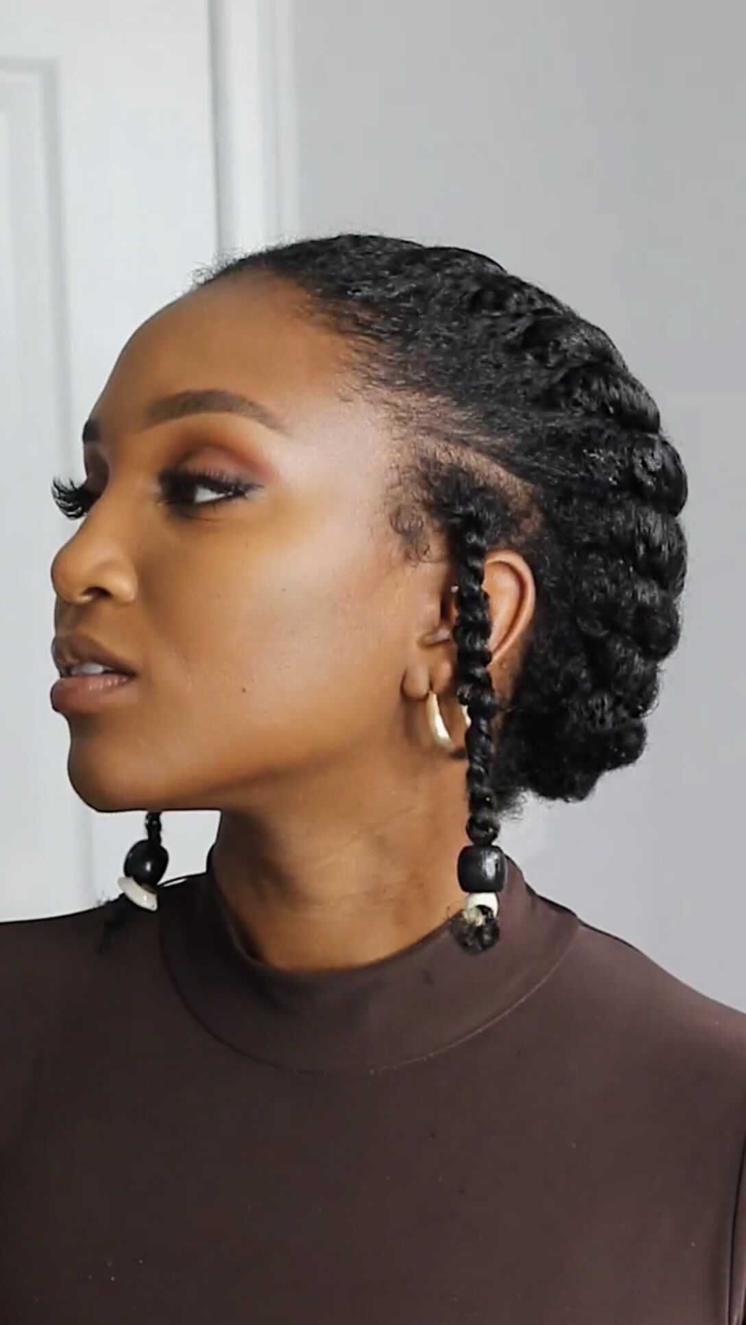 6 Twist Outs on 4c Hair Ideas for Every Look and Length 3 Woman with black hair styled in flat twists and hanging twist ends.