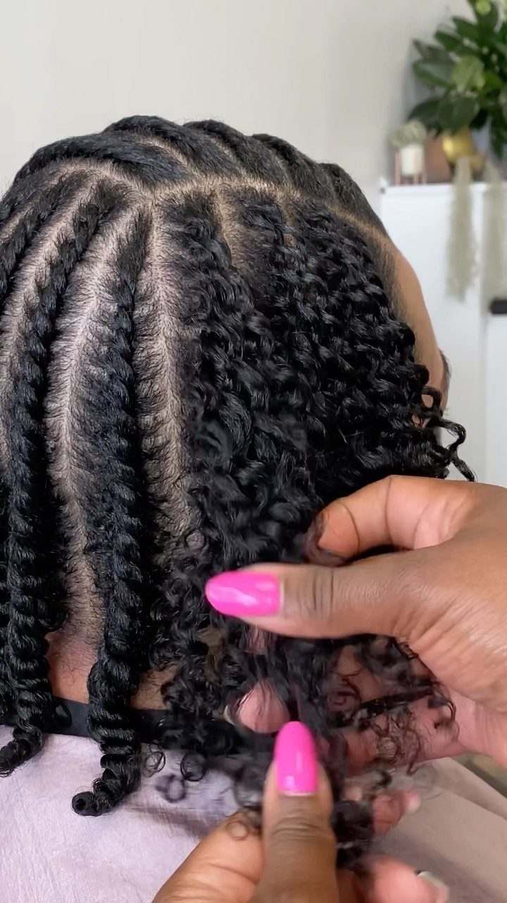6 Twist Outs on 4c Hair Ideas for Every Look and Length 1 Black 4c hair in defined twists being gently separated by hands with pink nails.