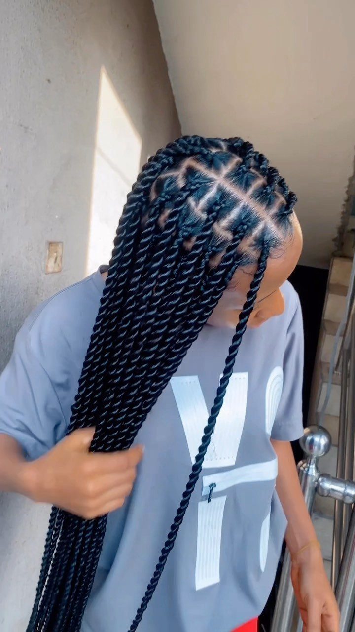 6 Twist Outs on 4c Hair Ideas for Every Look and Length 6 Person with long black two-strand twists styled in a grid pattern on scalp