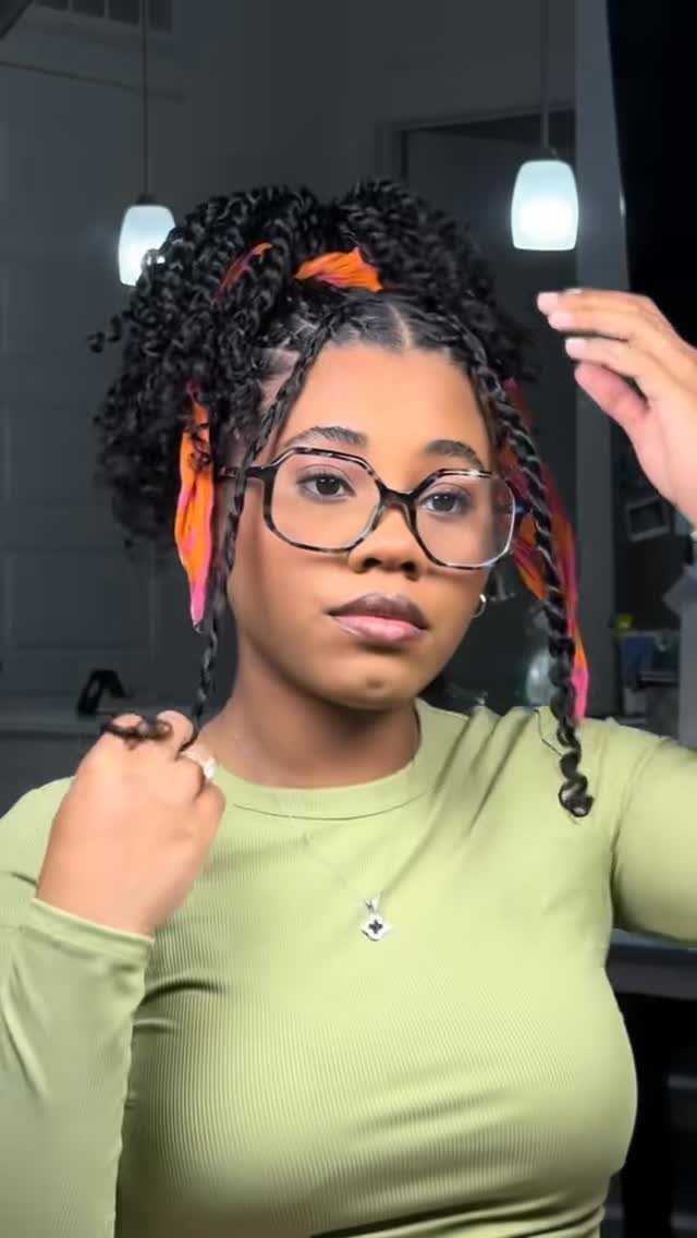 Two Strand Twist Natural Hair Women: 10 Style Ideas 6 Woman with two-strand twist hair updo, wearing glasses and a colorful headwrap.