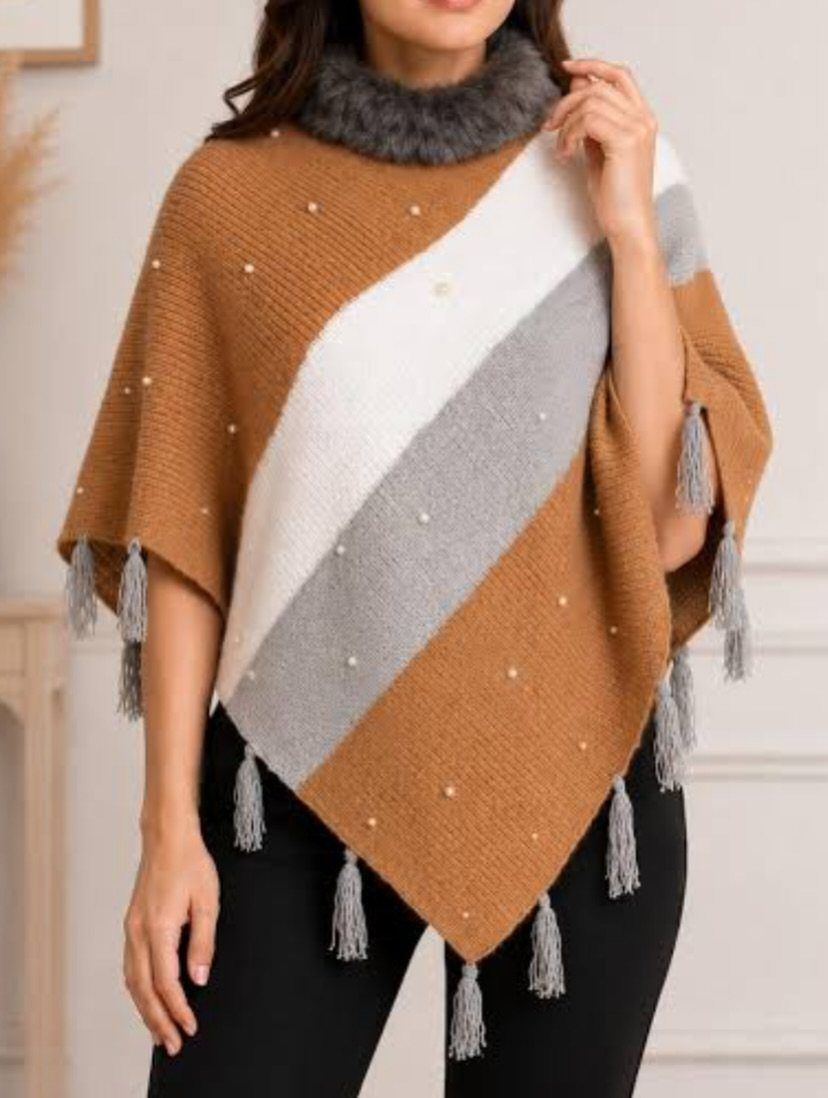 13 Winter Wear Ideas for Women: Coats, Knits and Boots 12 Woman wearing a striped knit poncho with faux-fur collar and grey tassels.